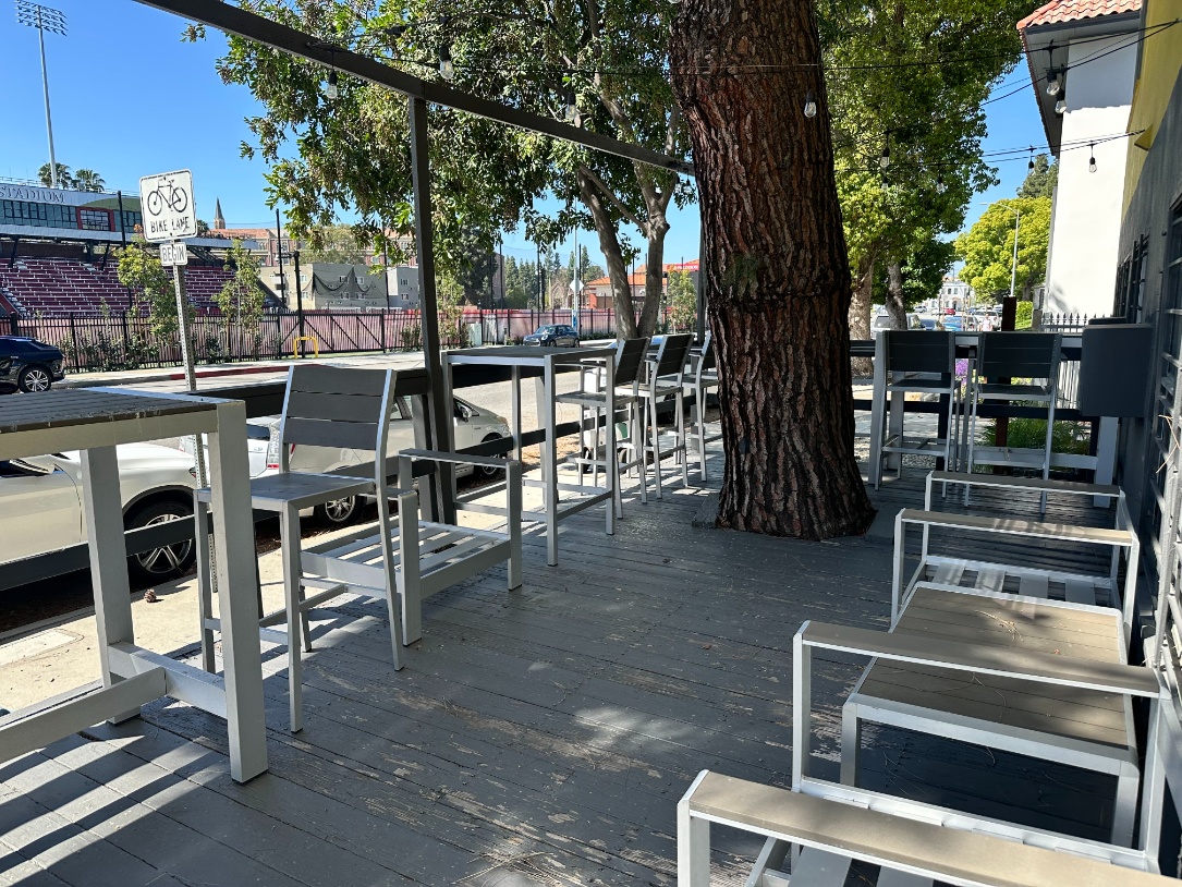 Streetfront patio seating at Heritage 2831