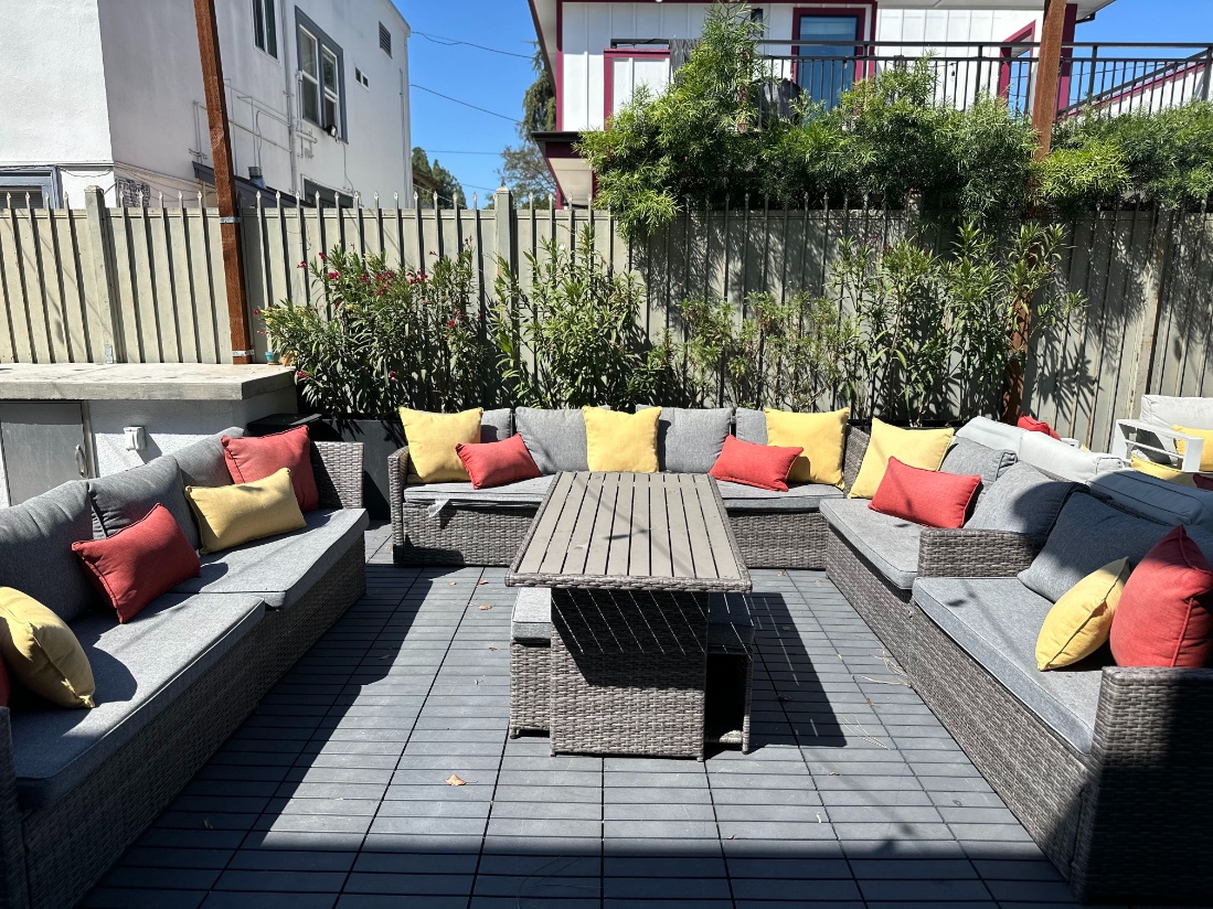 Sofas on the sunny outdoor patio at Heritage 2831