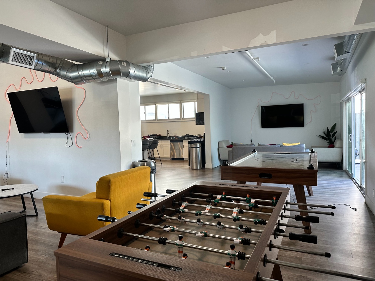 Social common area with air hockey and foosball at Heritage 2831