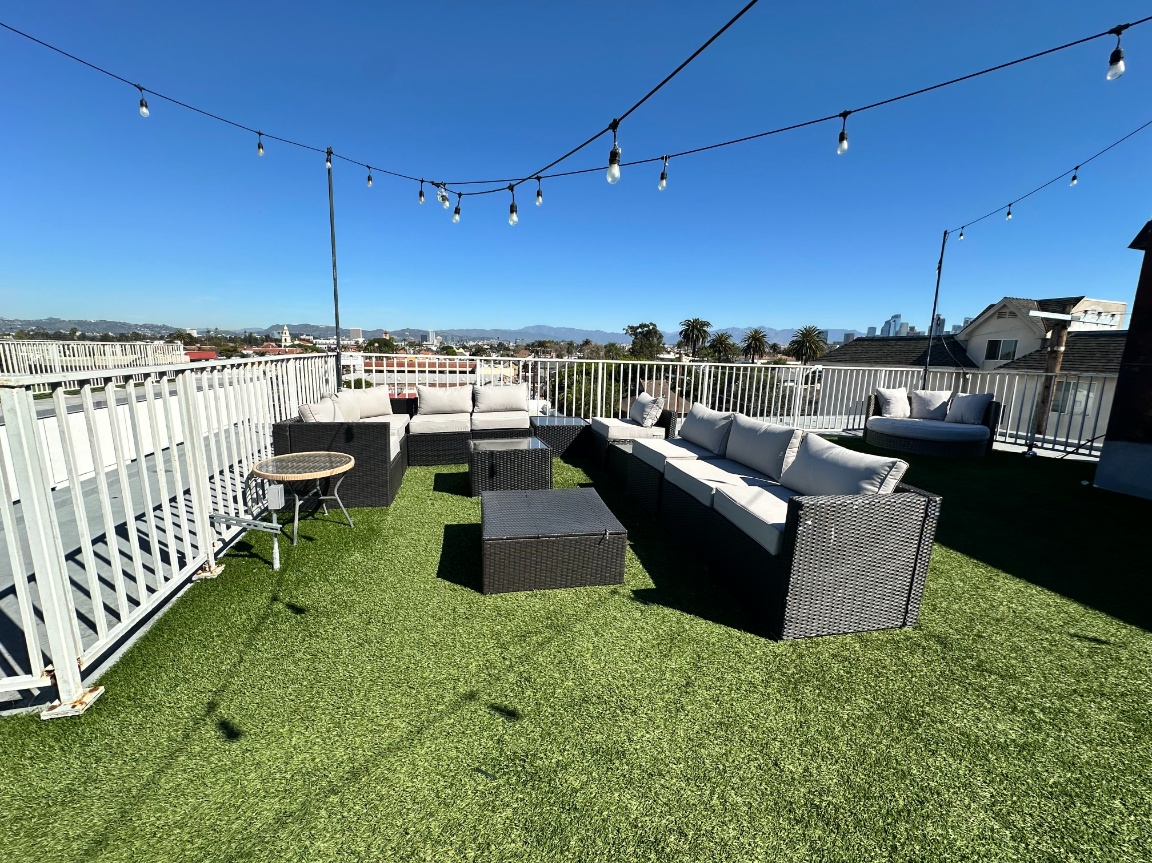Outdoor social lounge on the rooftop with views of downtown LA at Heritage 1275