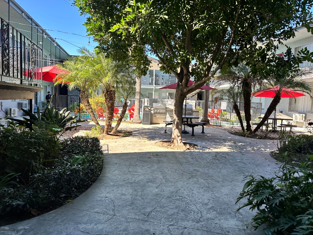Courtyard with picnic tables and grilling stations at Heritage 2353